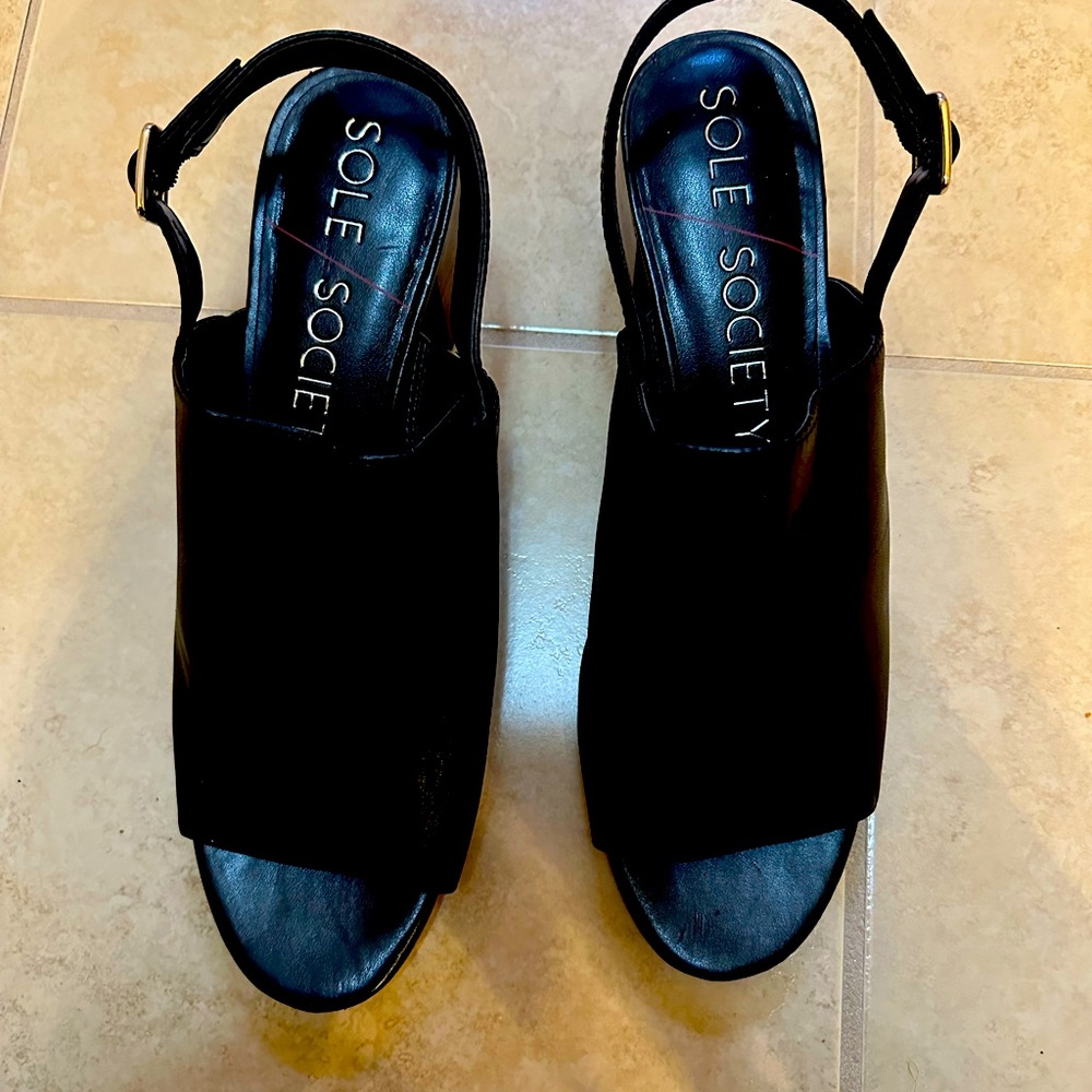 Black leather open toe and open mid heel.  Size 11 medium.